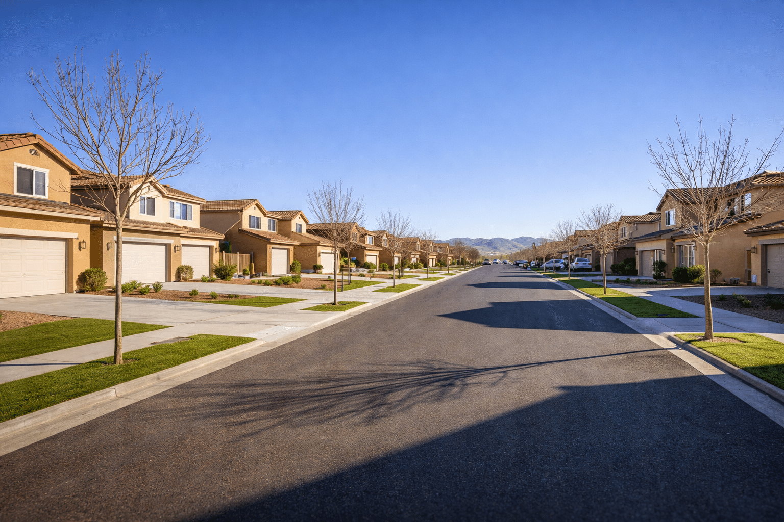 Casa Grande Arizona homes for sale residential street in winter with blue sky and new construction neighborhood — West USA Realty
