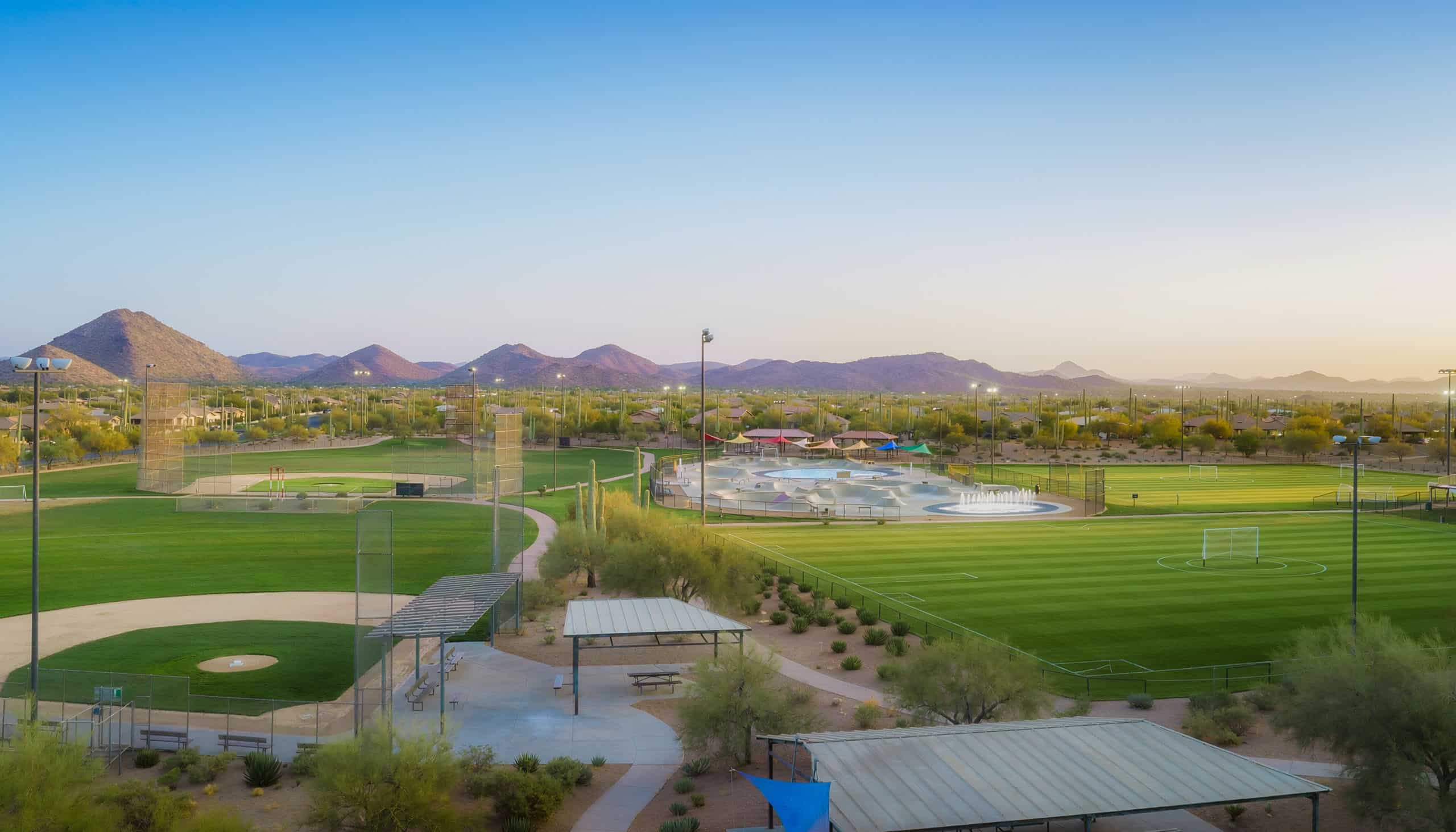 A high-fidelity, expansive landscape photograph of the 60-acre Anthem Community Park