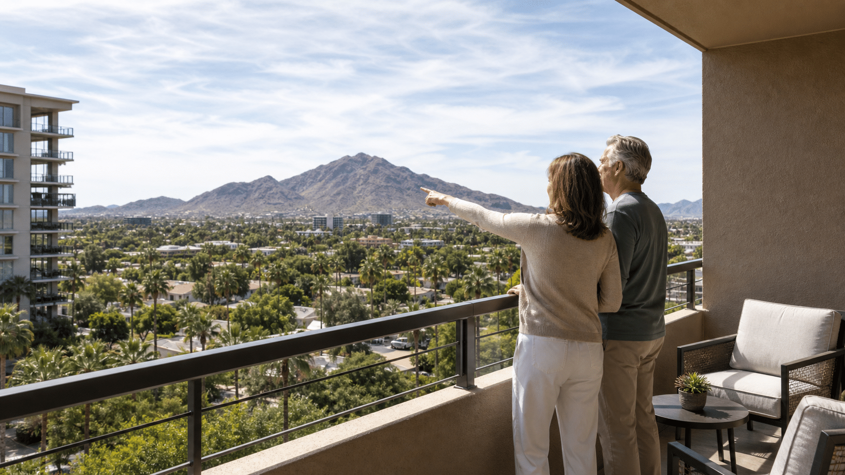couple standing together on a private upper-floor balcony at Scottsdale Shadows in central Scottsdale, Arizona