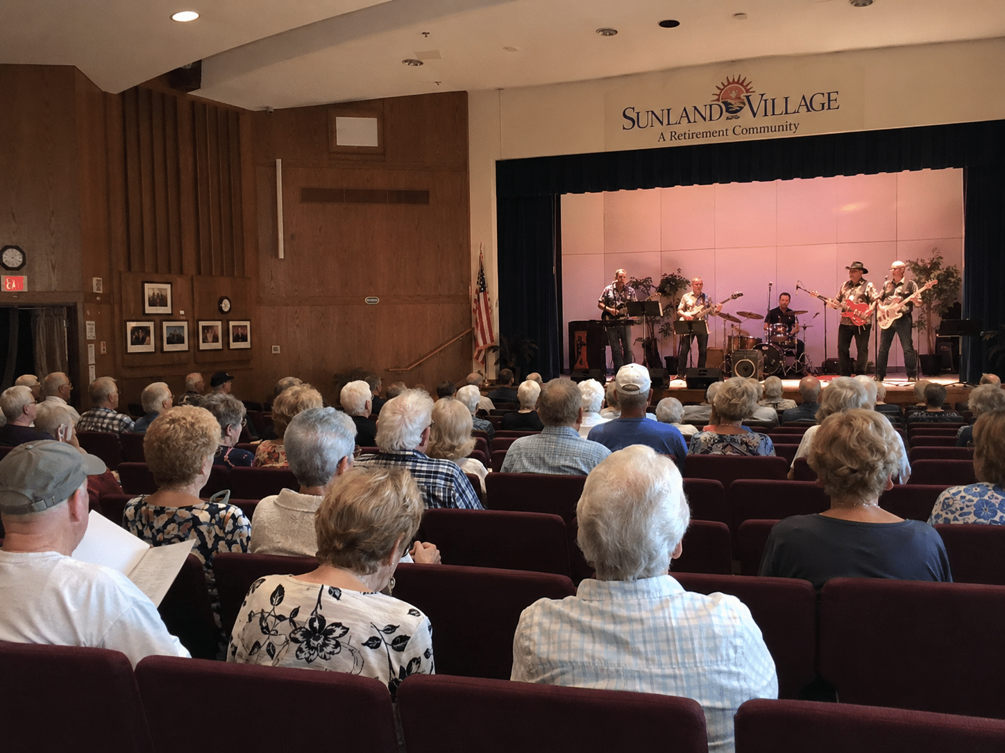 Mesa Real Estate community image of the Sunland Village auditorium during a live concert performance - West Usa Realty