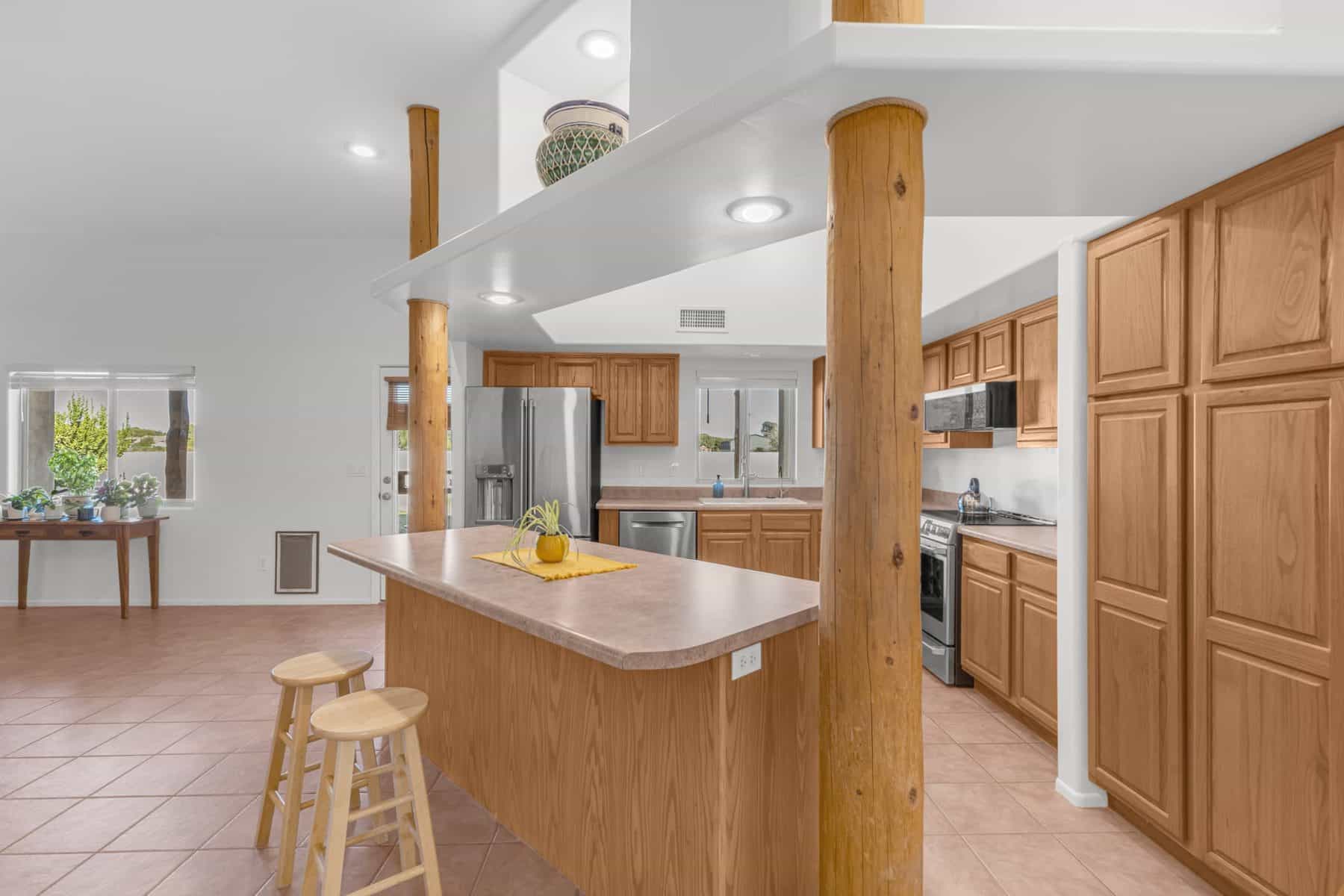 Kitchen with island, oak cabinets and stainless appliances